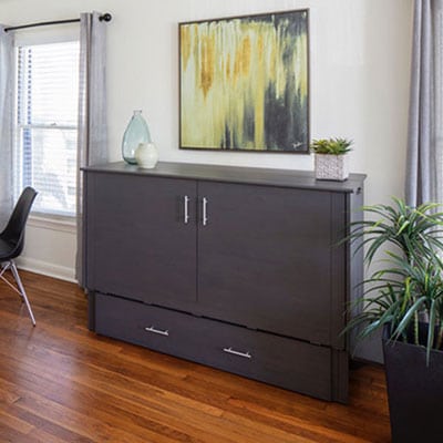 Cabinet bed closed as living-room furniture