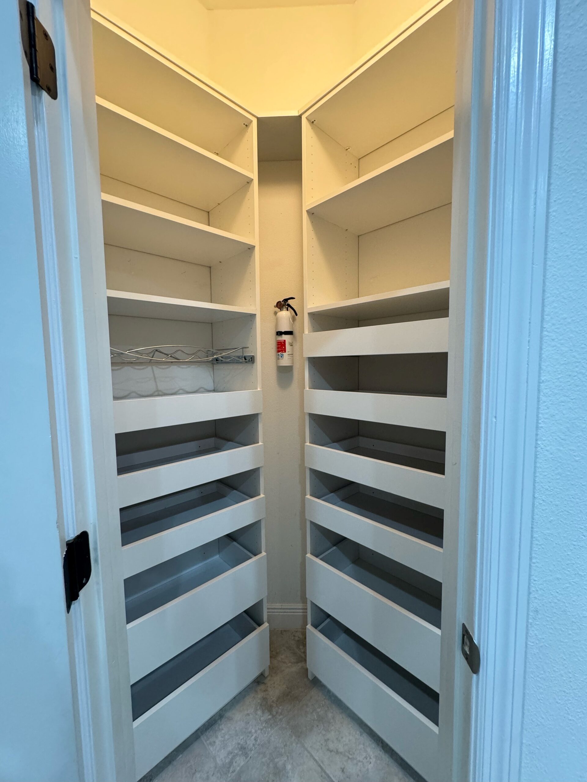 White pantry with wire drawers and shelving